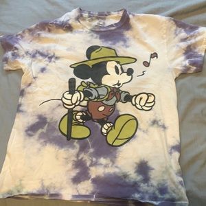 This is a Mickey Mouse shirt from Disney with white and purple tye-dye shirt